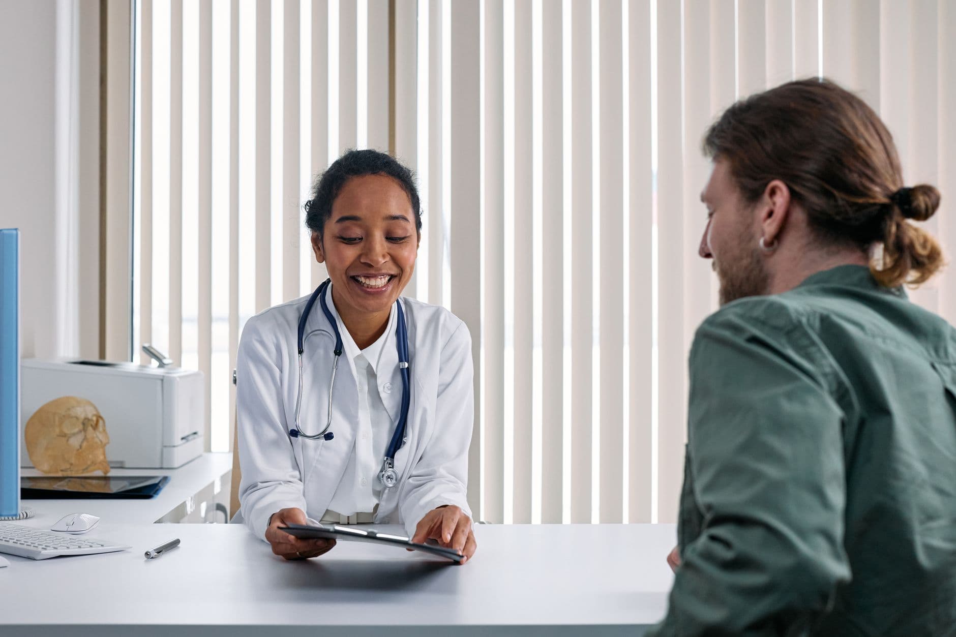 Doctor consulting with a smiling patient