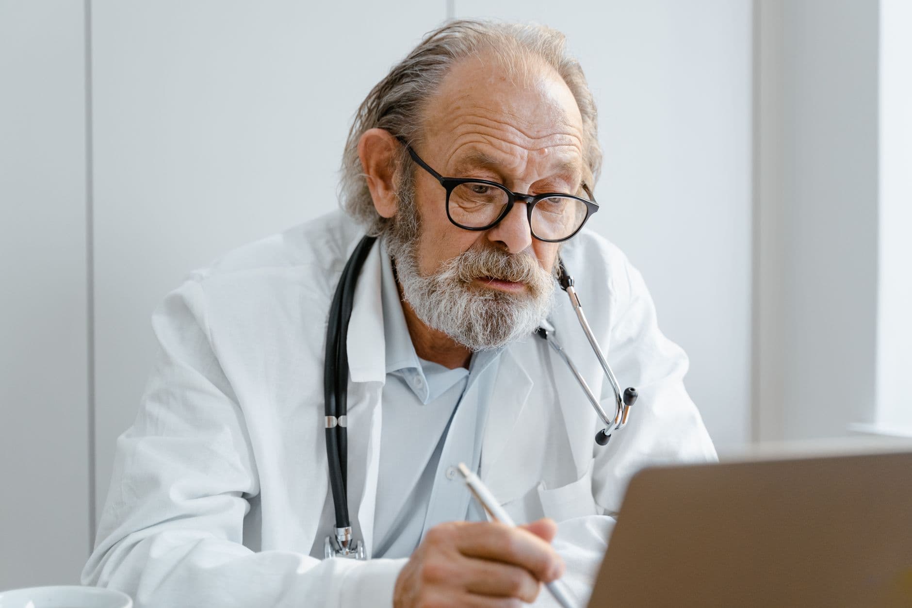 Physician reviewing their online reputation on a laptop